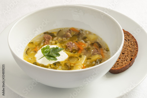 solyanka soup with sour cream and rye bread
