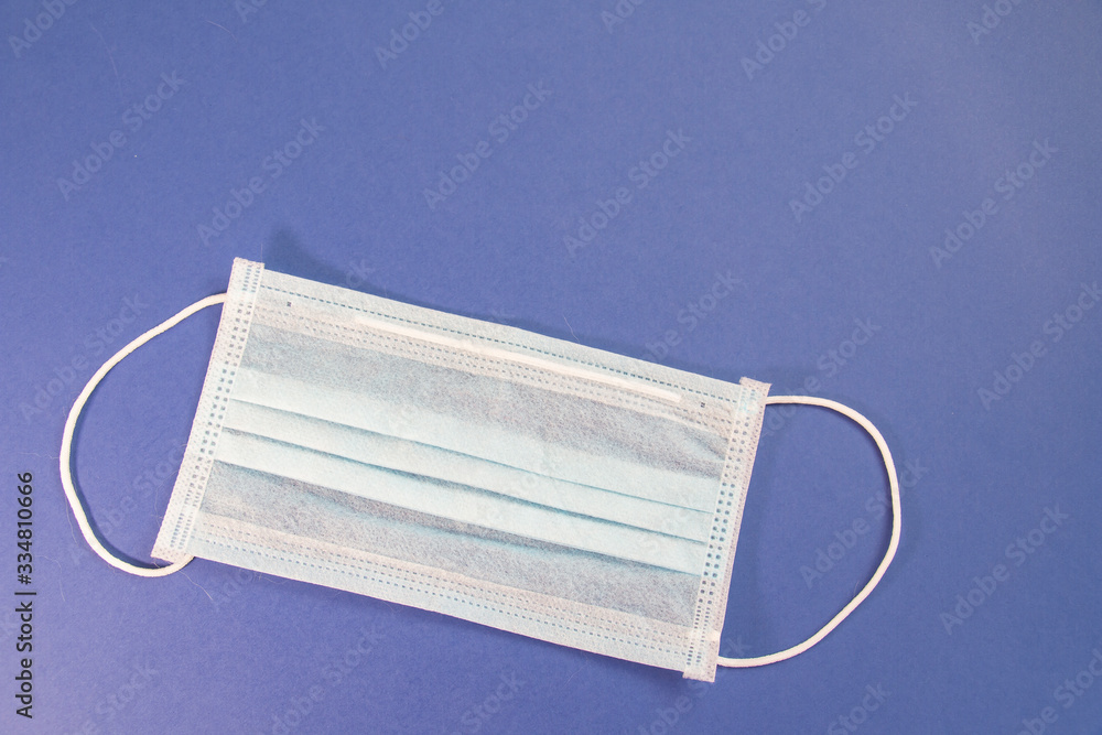 virus mask, concept of coronavirus quarantine in the world on a blue background virus mask, concept of coronavirus quarantine in the world on a blue background