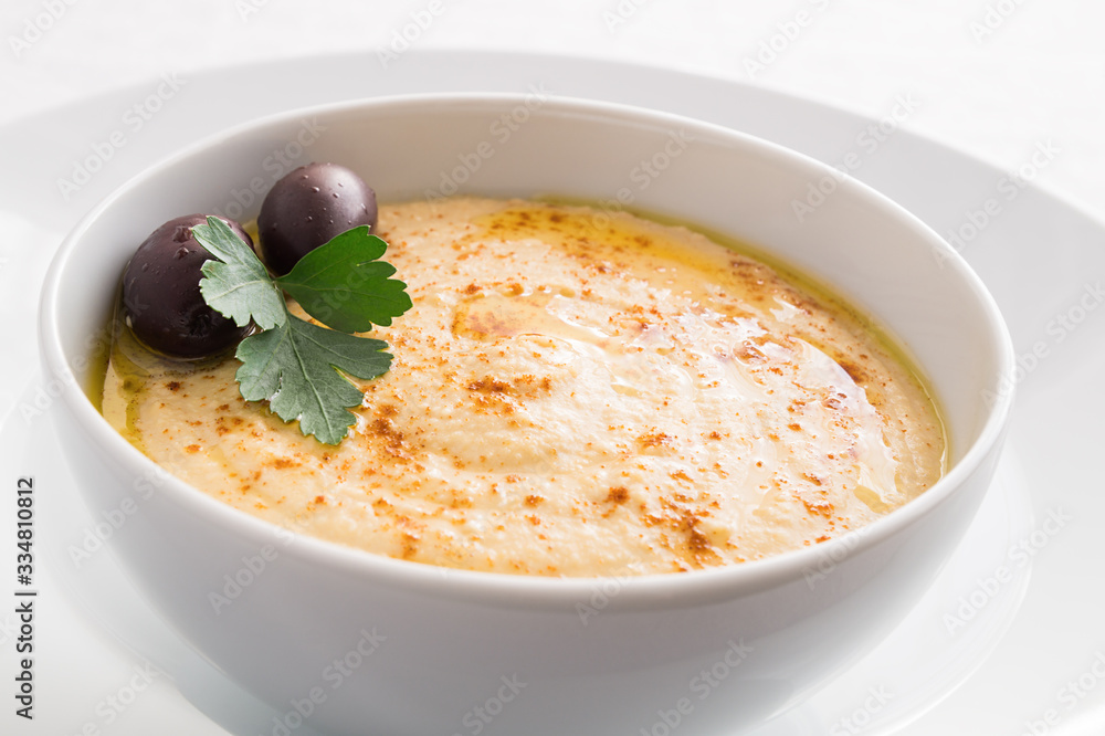 hummus bowl decorated with olives and parsley hummus bowl decorated with olives and parsley