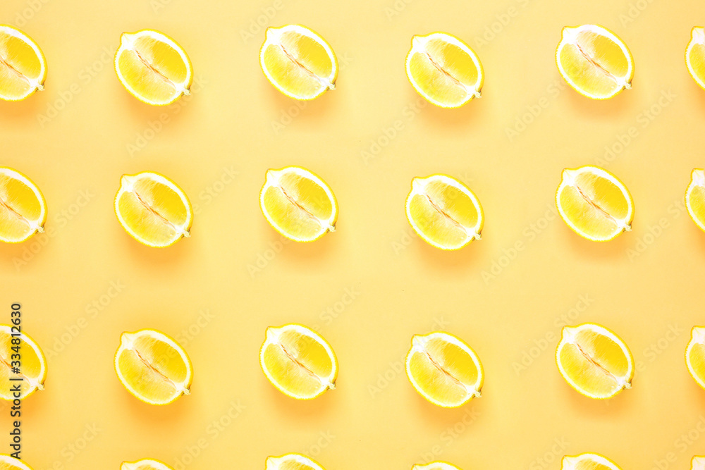 Fruit summer pattern with sliced lemon. Flat lay composition on yellow background. top view Fruit summer pattern with sliced lemon. Flat lay composition on yellow background. top view