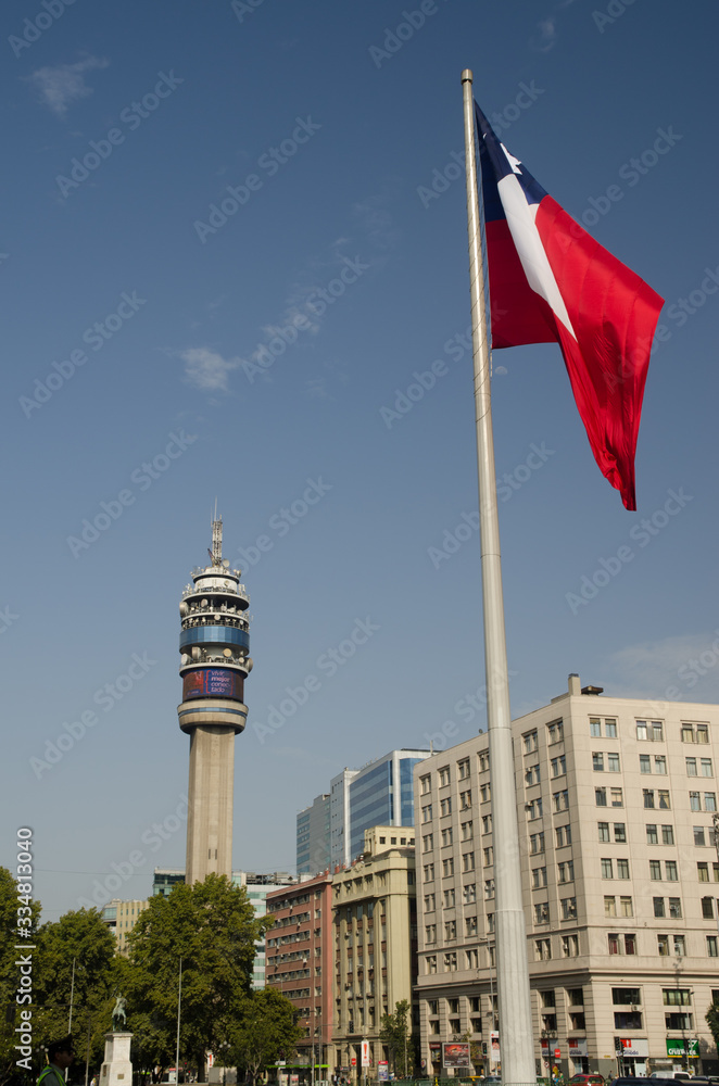 Entel Tower and flag of Chile in the Libertador Bernardo O'Higgins Avenue.