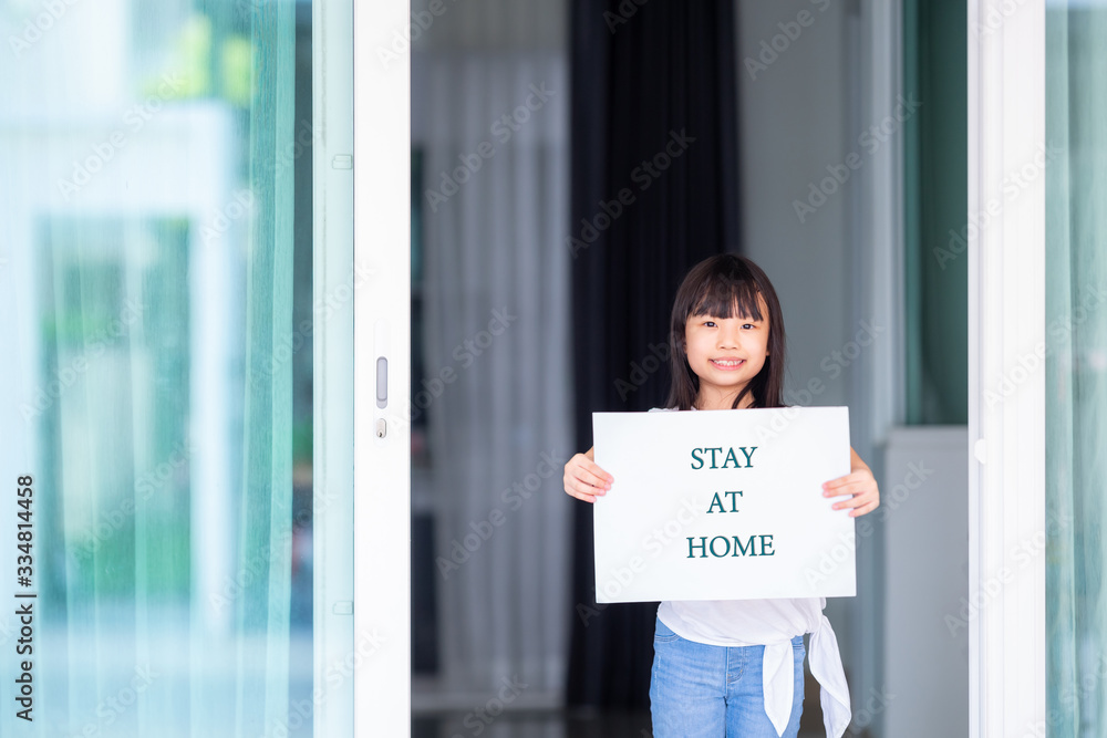 Asian little girl with her paper show the screen 