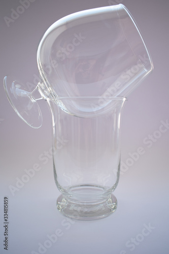 Glass and vase on a white background