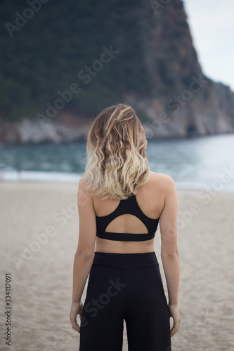 Fitness concept. Backview portrait of a fit female in black outf