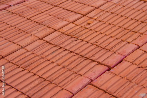 Stack of Red clay brick. Building brick