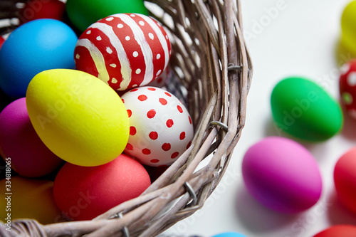 Easter Day, Basket with colorful decoreted Easter Eggs photo