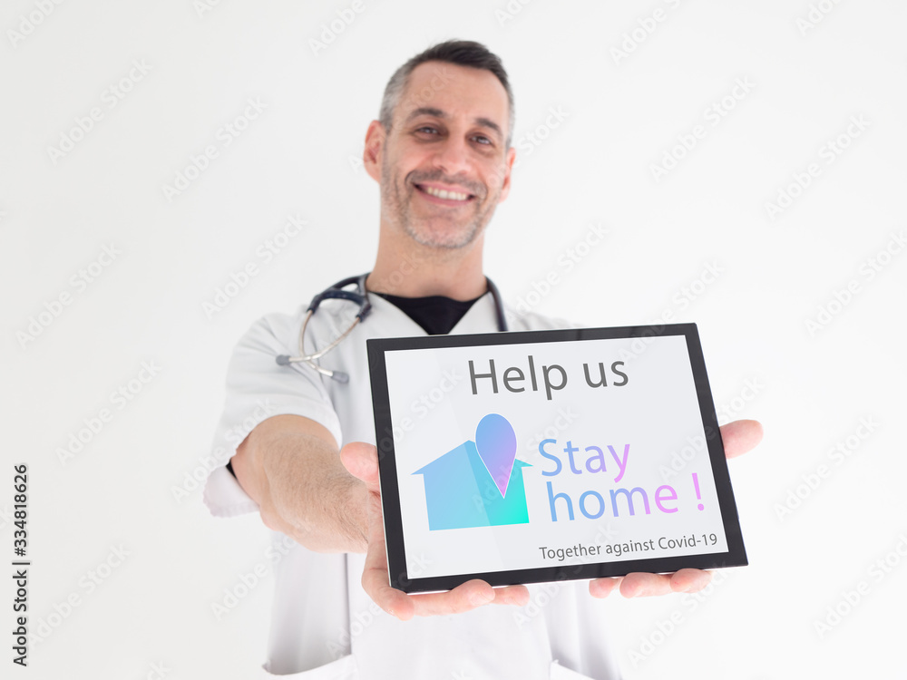 Handsome middle aged male doctor hands an advice written on his tablet : Handsome middle aged male doctor hands an advice written on his tablet :