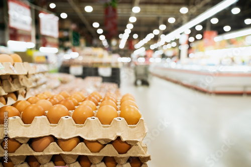 Fresh chicken eggs for choosing in supermarket, buying and hoarding during the Covid-19, Corona virus epidemic. Preparing for pathogen virus pandemic photo