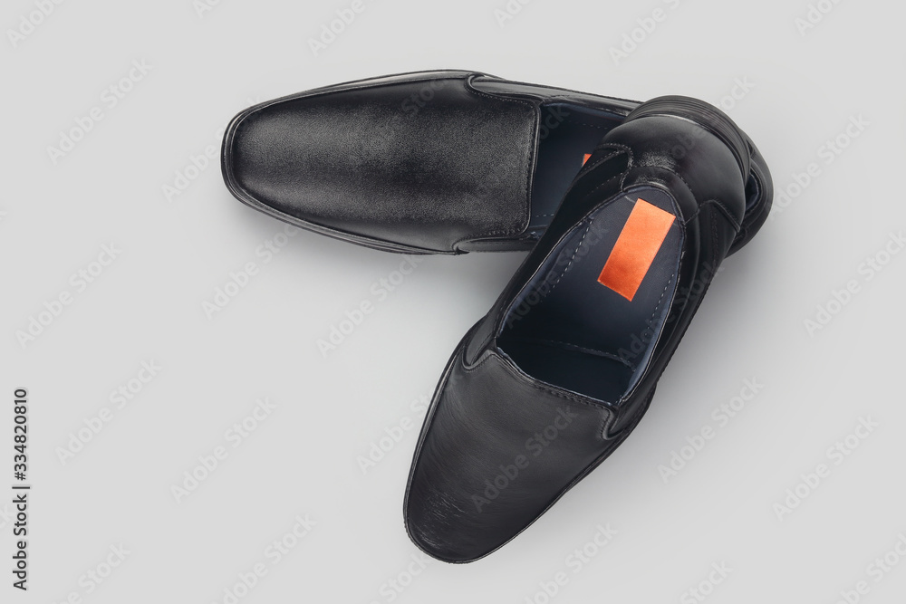 Black leather elegant shoes on gray background Black leather elegant shoes on gray background