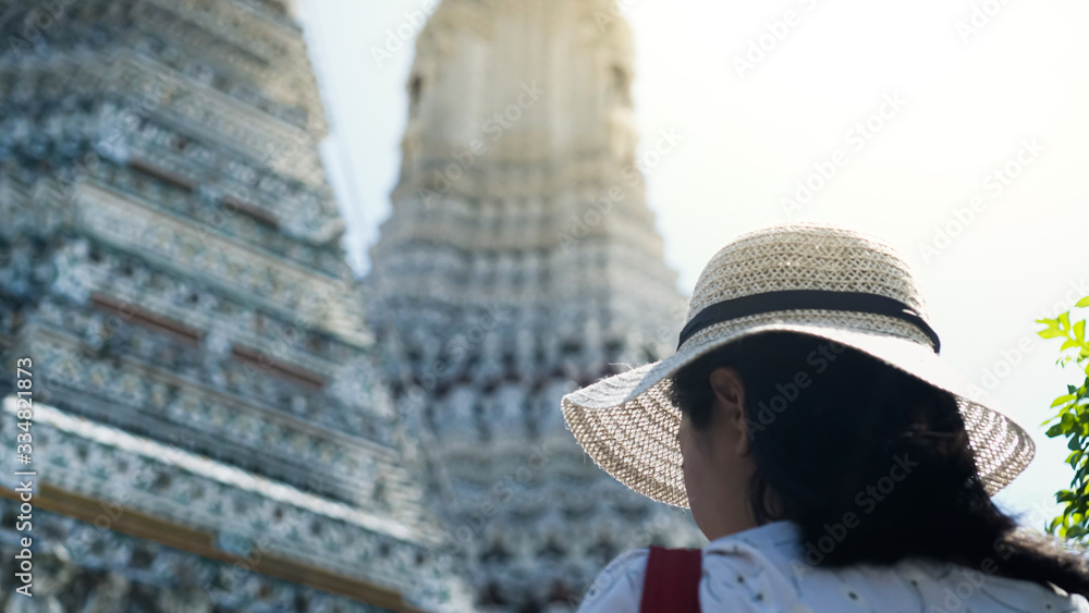 Asian lady enjoying for traveling at Wat Arun. Bangkok. Thailand.