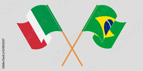 Crossed and waving flags of Brazil and Italy