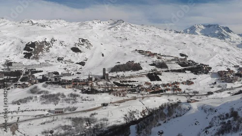 Stunning winter landscape and ski resort with typical alpine wooden houses in French Alps,Les Menuires,3 Vallees,France,Europe