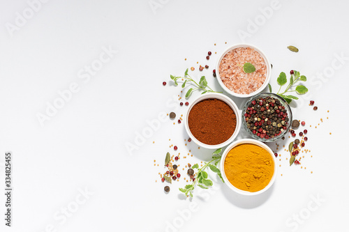 Spices  herbs and Himalaya salt on white background with copy space for your text. Template culinary blog social media.