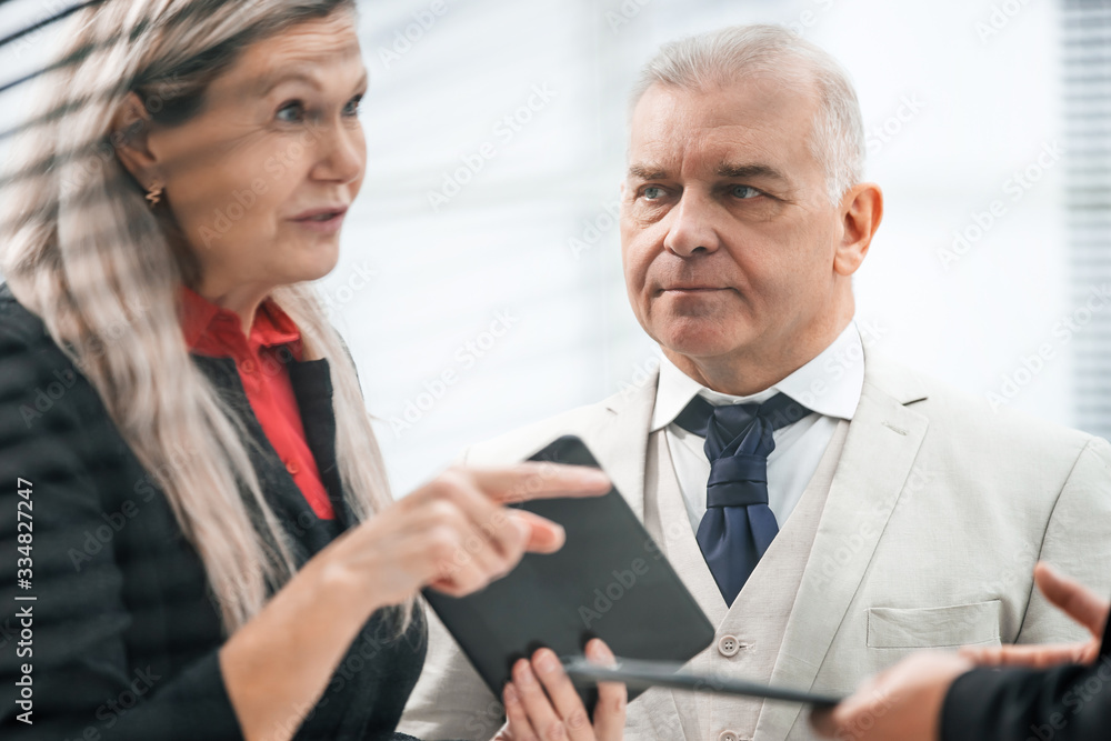 close up. serious business man standing in office. close up. serious business man standing in office.