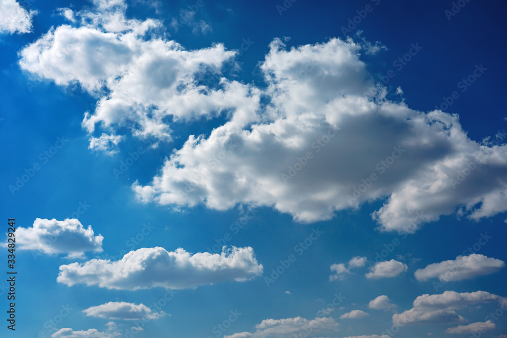 Obraz premium cirrocumulus clouds on the blue background on a sunny day