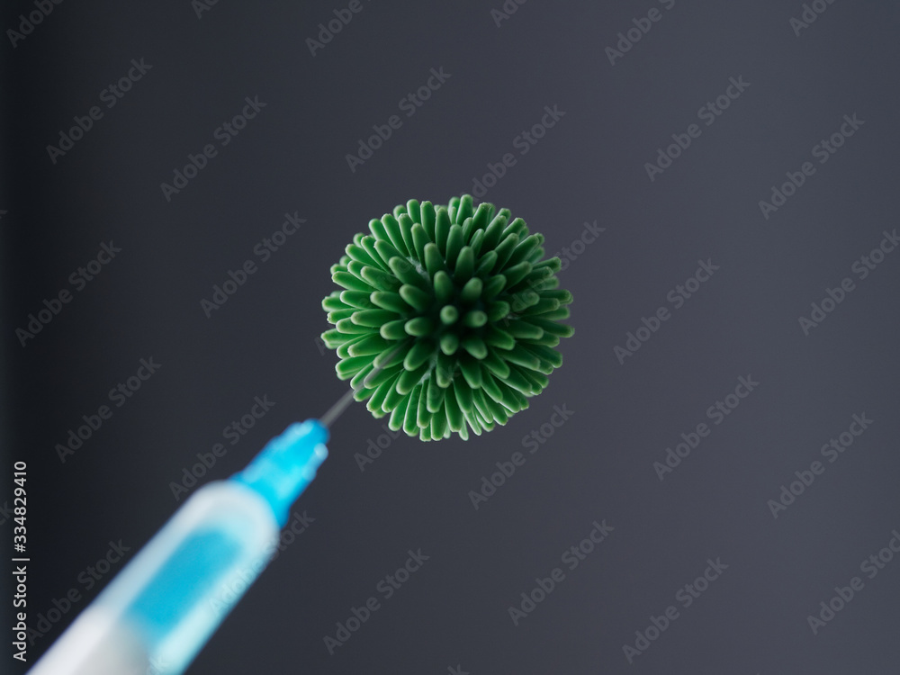 Close-up shot. Syringe and coronavirus. Covid-19 Pandemic Coronavirus. Close-up shot. Syringe and coronavirus. Covid-19 Pandemic Coronavirus.