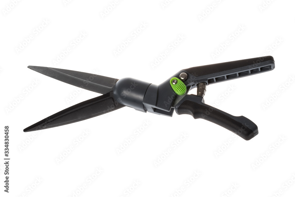 Opened black grass shears with angle rotation and spring mechanism, isolated on white background Opened black grass shears with angle rotation and spring mechanism, isolated on white background
