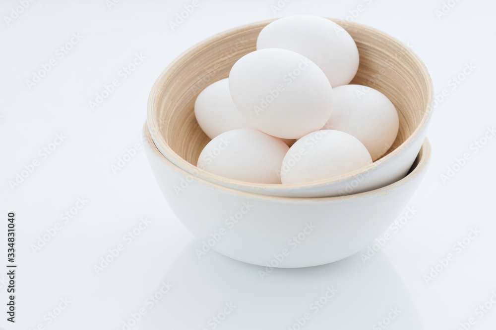 eggs in a bowl isolated on white eggs in a bowl isolated on white