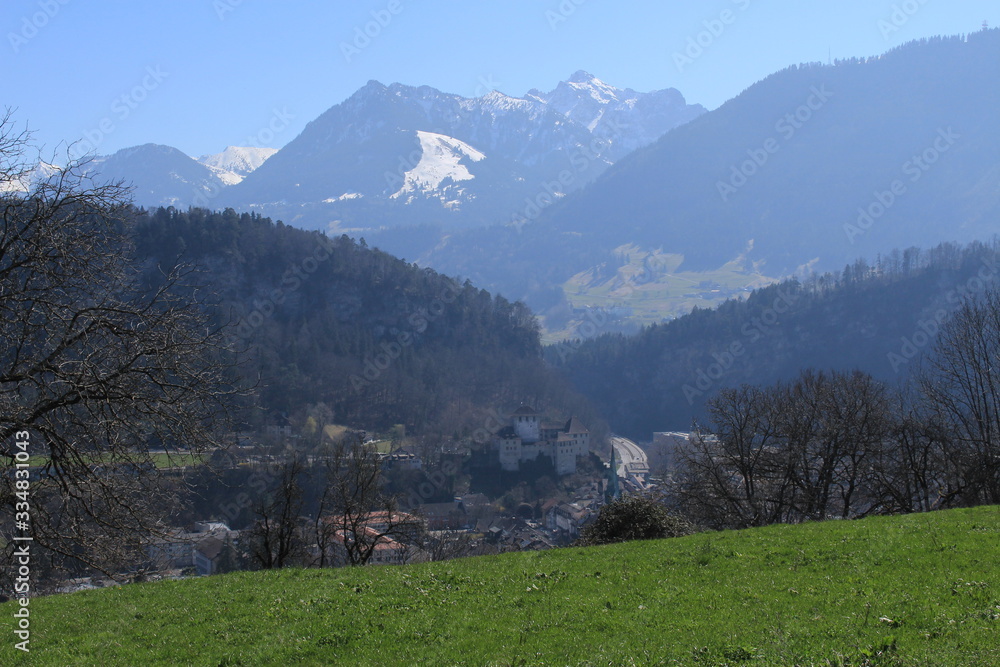 Naklejka premium Medieval Schattenburg Castle with Alp mountains in the background in Feldkirch, Vorarberg, Austria.