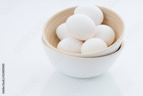 eggs in a bowl isolated on white