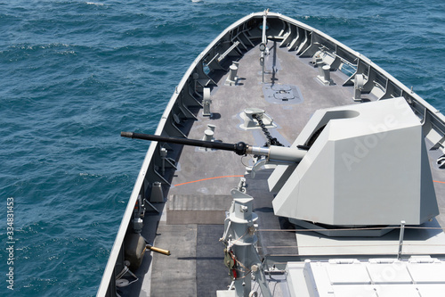Fotografie High technology modern naval main gun mounted on the stealth frigate warship use