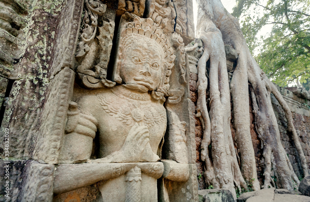 Soldier of Khmer army on relief of the 12th century entrance to temple and university Preah Khan, Cambodia. Historical carvings in Angkor. UNESCO world heritage site