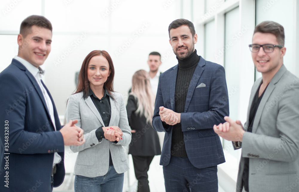 group of business people supporting each other with applause.