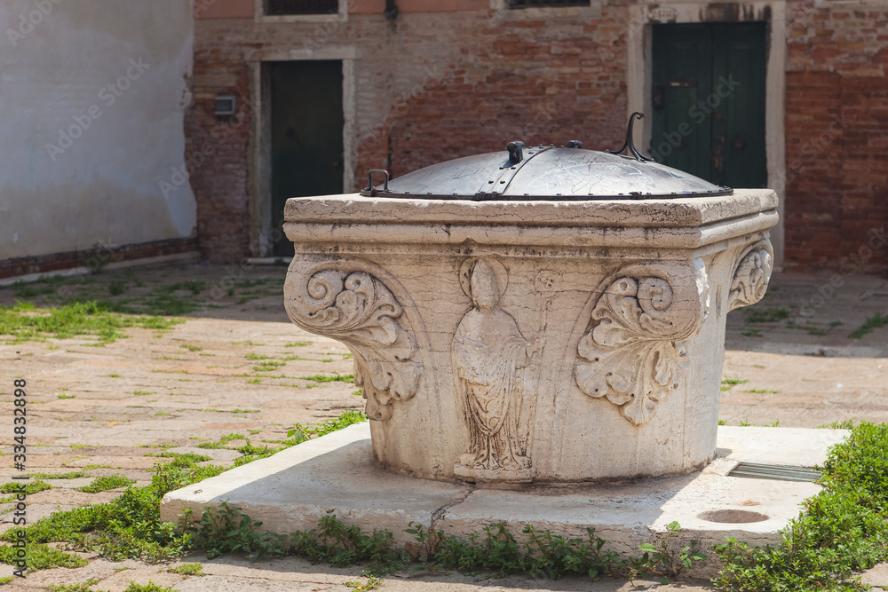 Ancient well at The Plaza del Orto in Venice, Italy