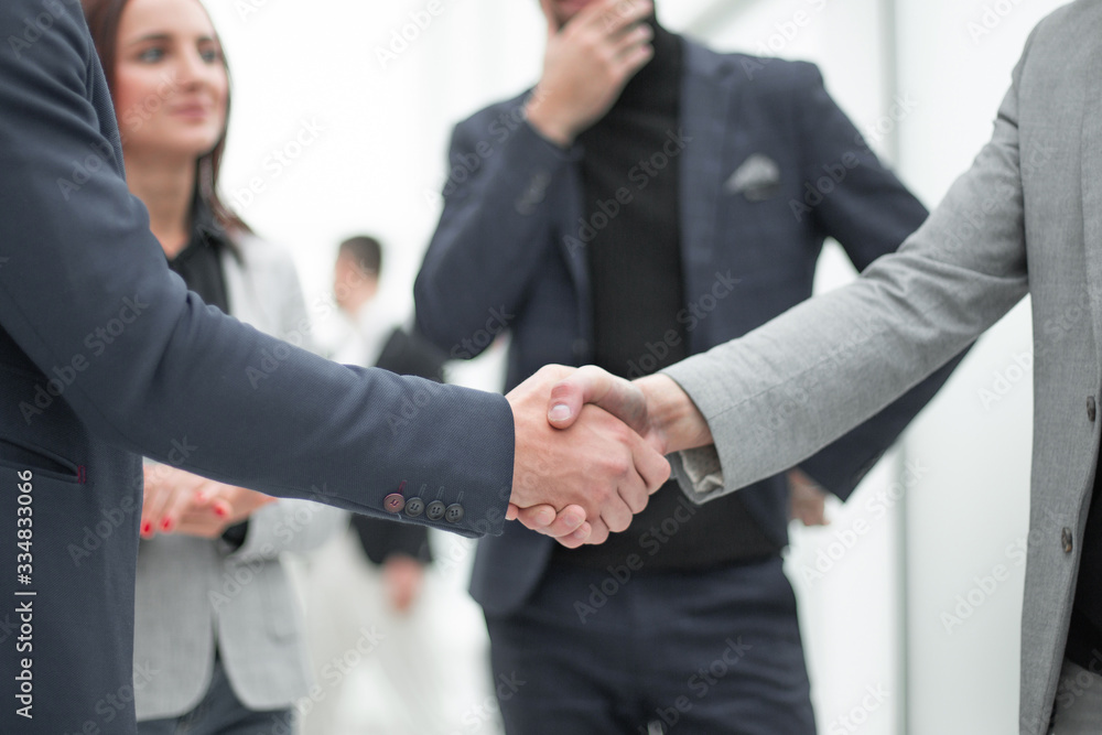 handshake of young business partners. the concept of cooperation