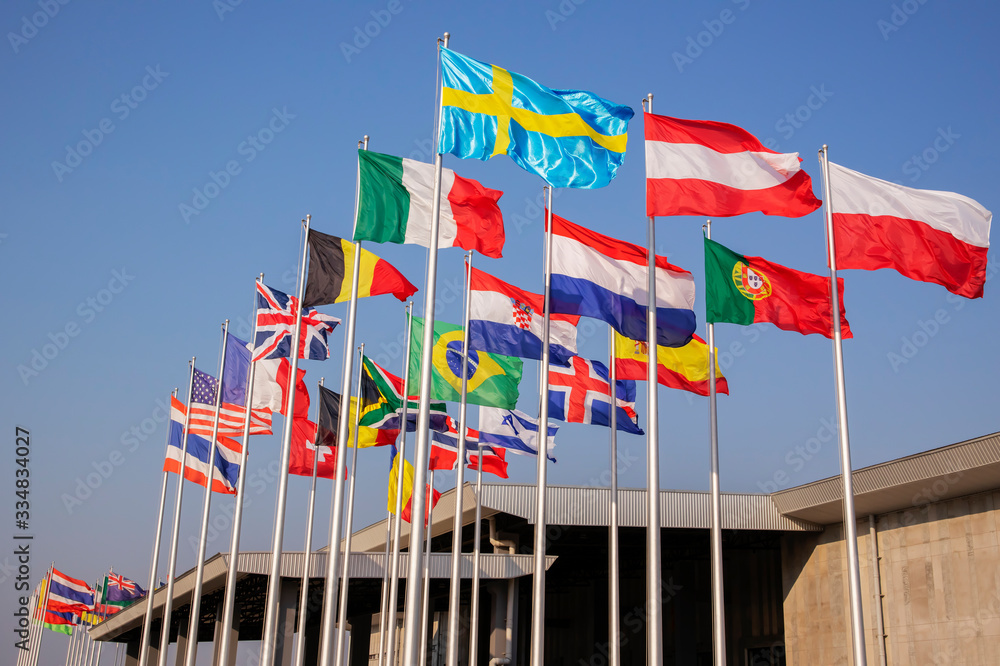 Nationals flag on top of pole in blue sky background that flags are swaying in the wind Nationals flag on top of pole in blue sky background that flags are swaying in the wind