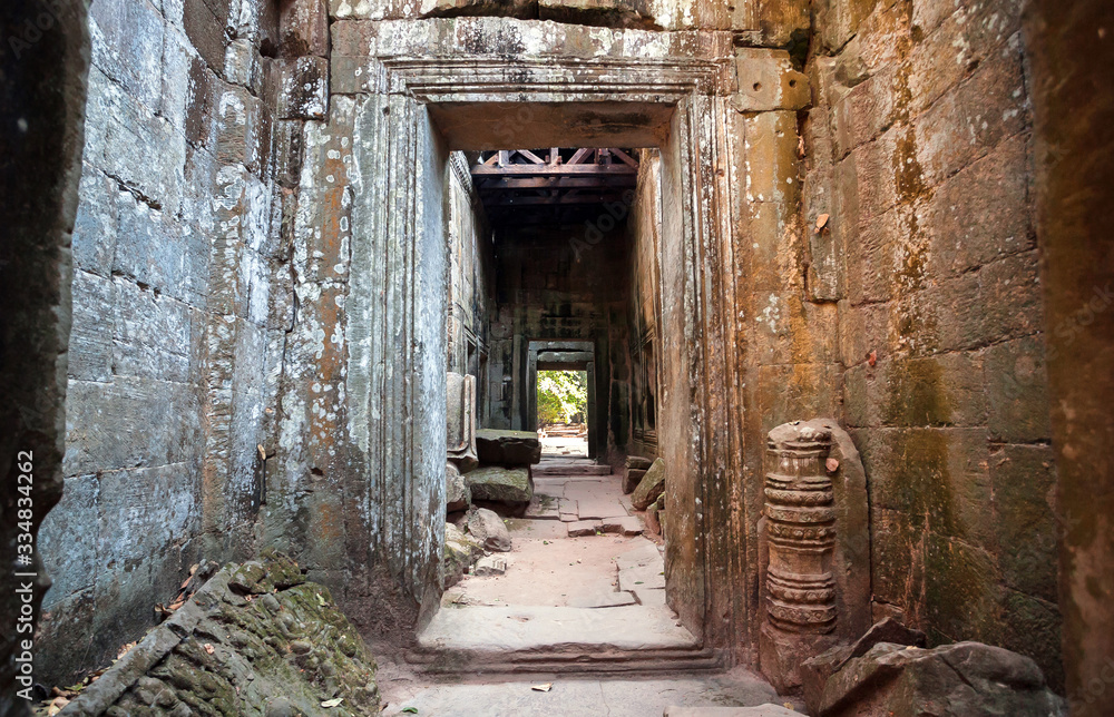 Narrow corridor in maze of the 12th century temple in Angkor, Cambodia. Historical structure