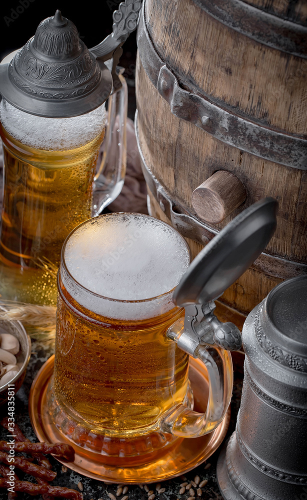 Light beer in a glass, on an old background. Light beer in a glass, on an old background.