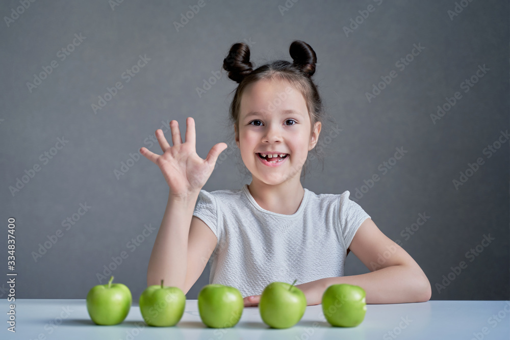 Beautiful funny girl with green apples. Proper nutrition is health. Beautiful funny girl with green apples. Proper nutrition is health.