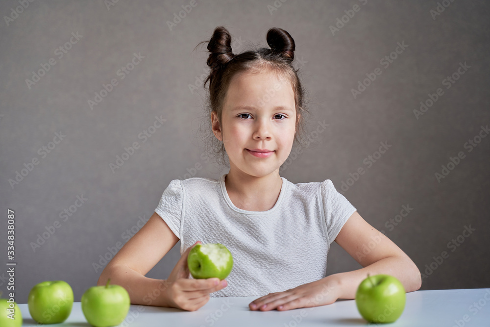 Beautiful funny girl with green apples. Proper nutrition is health. Beautiful funny girl with green apples. Proper nutrition is health.