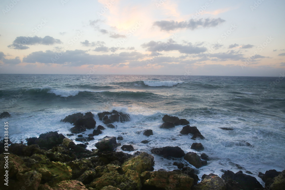 Stormy sunset on the Mediterranean Sea. Evening. Rocky coast. Sea Caves, Peyia, Cyprus Stormy sunset on the Mediterranean Sea. Evening. Rocky coast. Sea Caves, Peyia, Cyprus