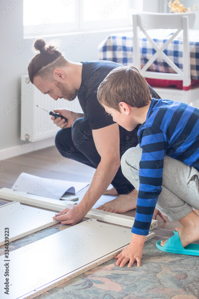 Father and son working together Father and son working together