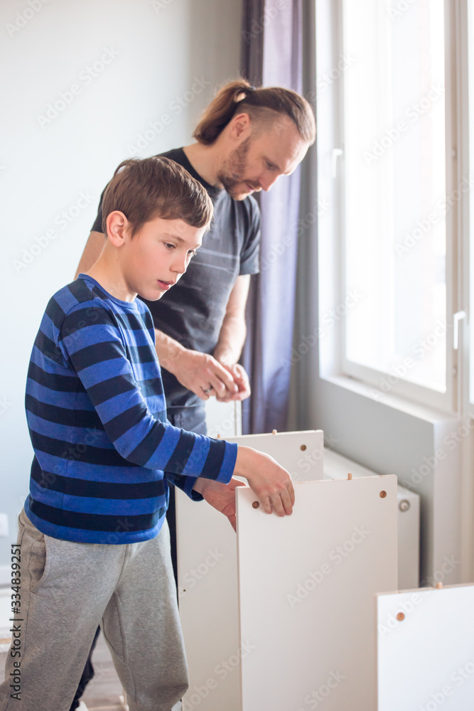 Father and son working together Father and son working together