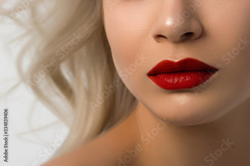 Closeup plump Lips. Lip Care, Augmentation, Fillers. Macro photo with Face detail. Natural shape with perfect contour. Close-up perfect red lip makeup beautiful female mouth. Plump sexy full lips
