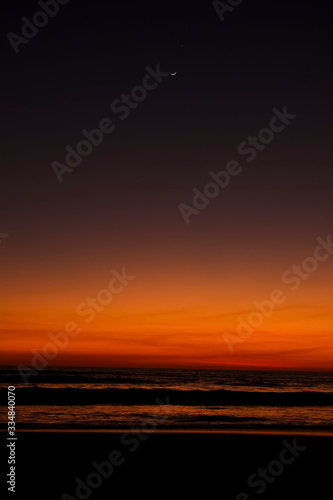 moon at sunset at the beach