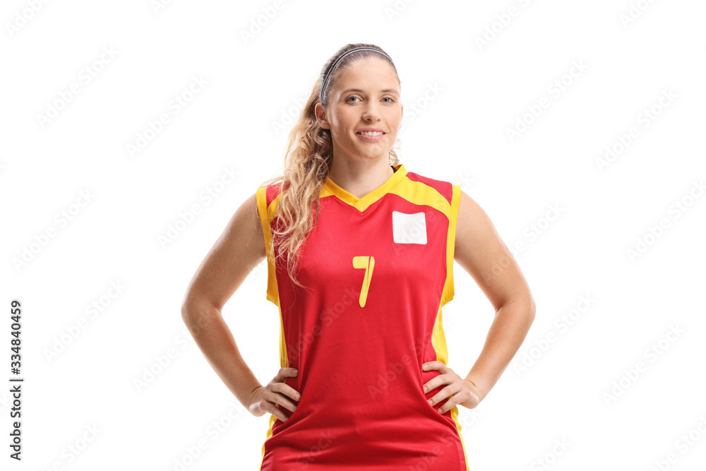 Woman basketball player posing and smiling at the camera Woman basketball player posing and smiling at the camera
