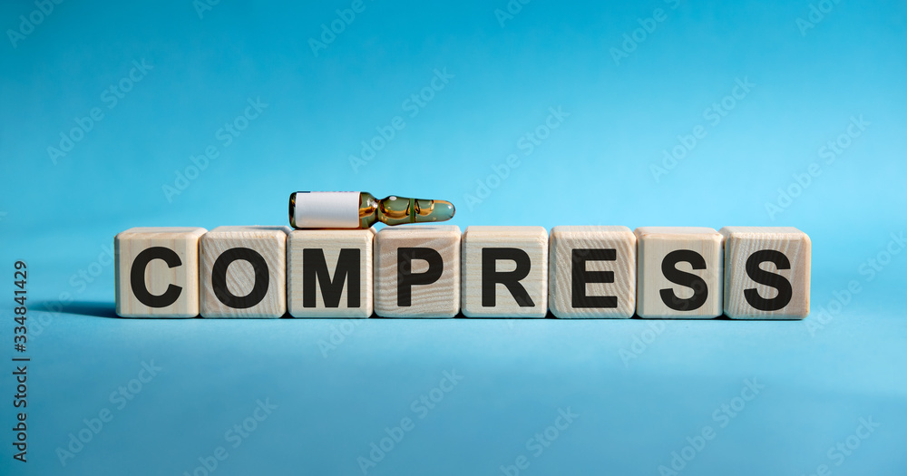 COMPRESS- text on cubes. Drug in ambula to reduce disease symptoms on a blue background