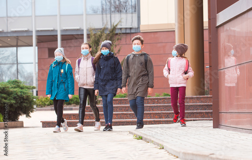 Wallpaper Mural city residents adults and children observe quarantine and go in masks. Torontodigital.ca