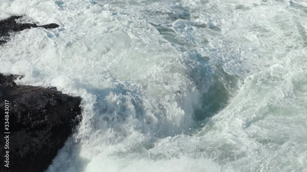 Huge swell breaking over rocks Huge swell breaking over rocks