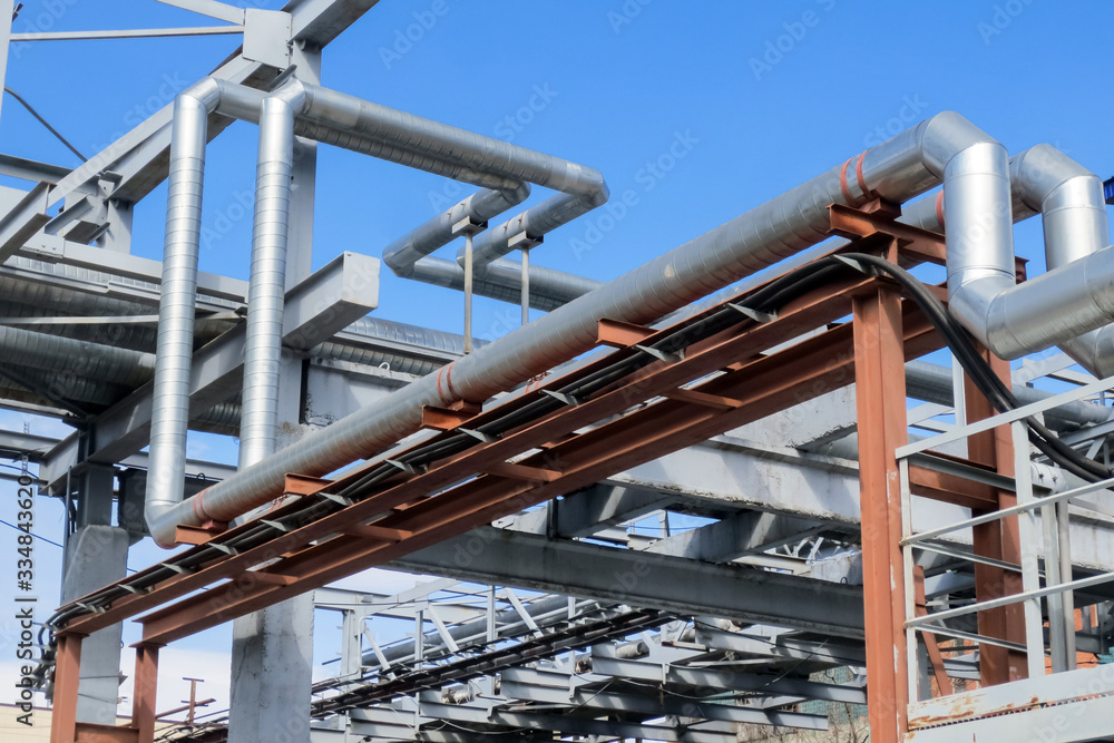 Pipes and cables in an industrial enterprise. Pipes and cables in an industrial enterprise.