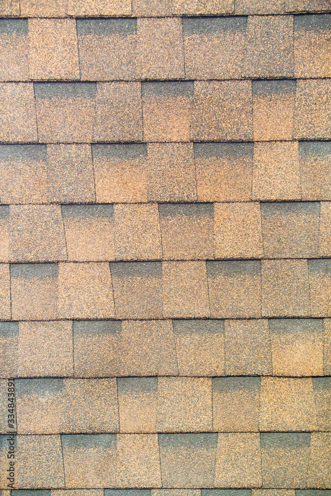 Tile is a multi-layer flexible brown rectangular shape. Construction, background, textures, design. Tile is a multi-layer flexible brown rectangular shape. Construction, background, textures, design.