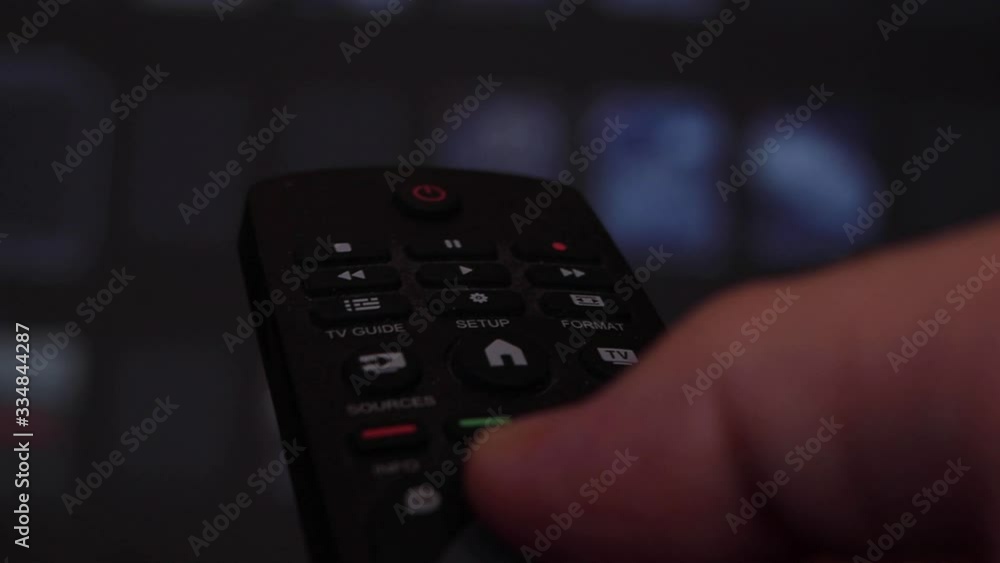 Hand Of Man Operating tv Remote At Home Hand Of Man Operating tv Remote At Home
