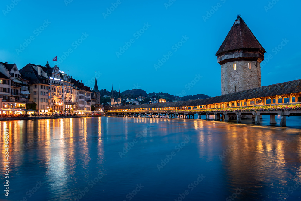 Famous Chapel Bridge, the city's symbol and one of the Switzerland's main tourist attractions, Switzerland. Historic city center of Lucerne
