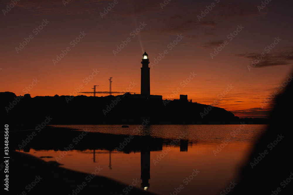 lighthouse of cadiz at sunset nigth