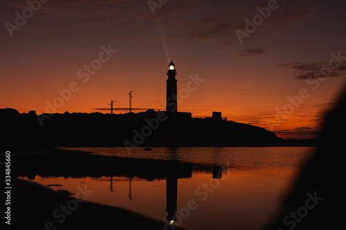 lighthouse of cadiz at sunset nigth