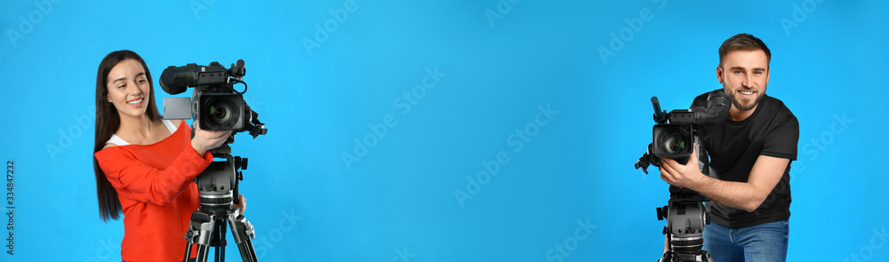 Operators with professional video cameras on blue background, space for text. Banner design